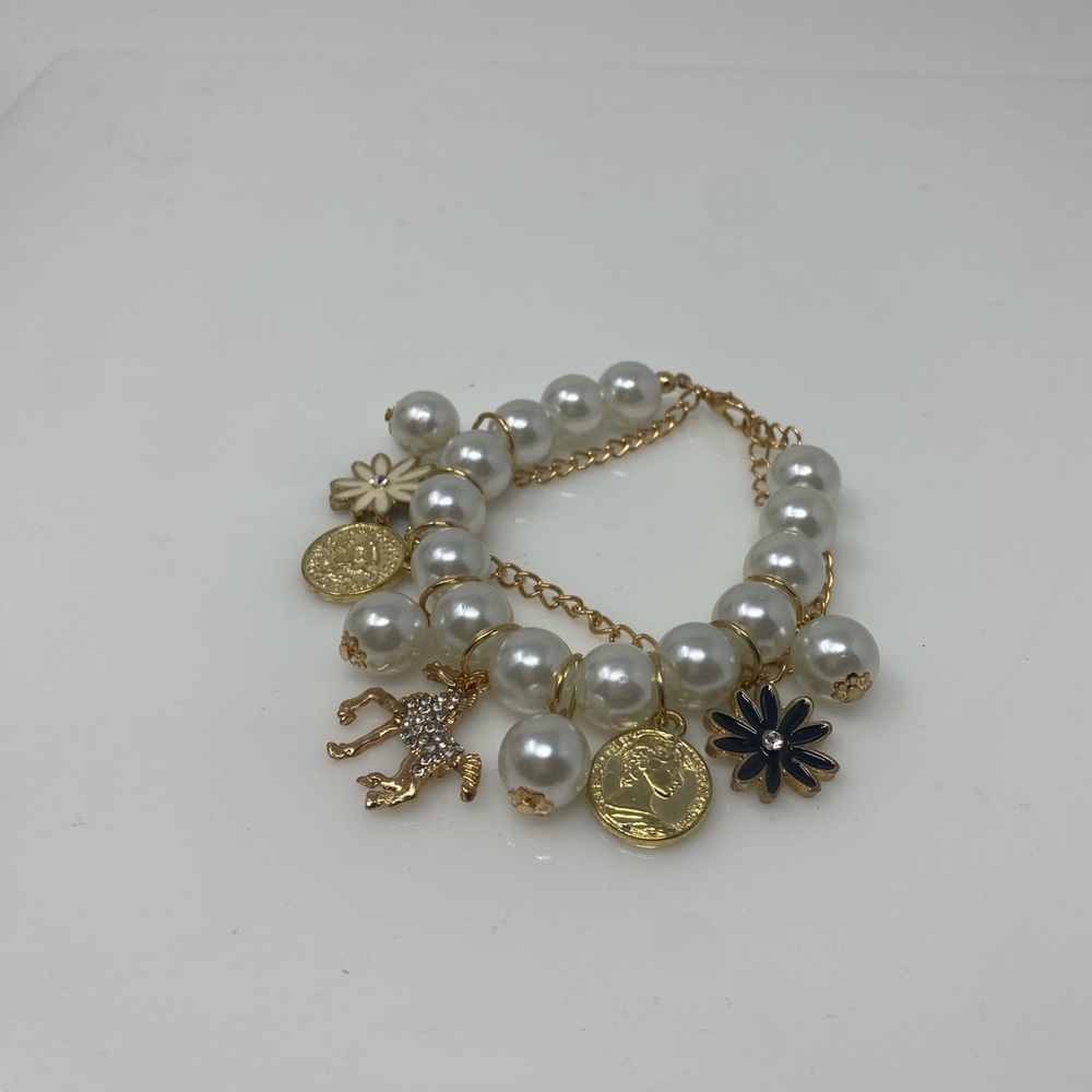 Elegant Gold and White Charm Bracelet